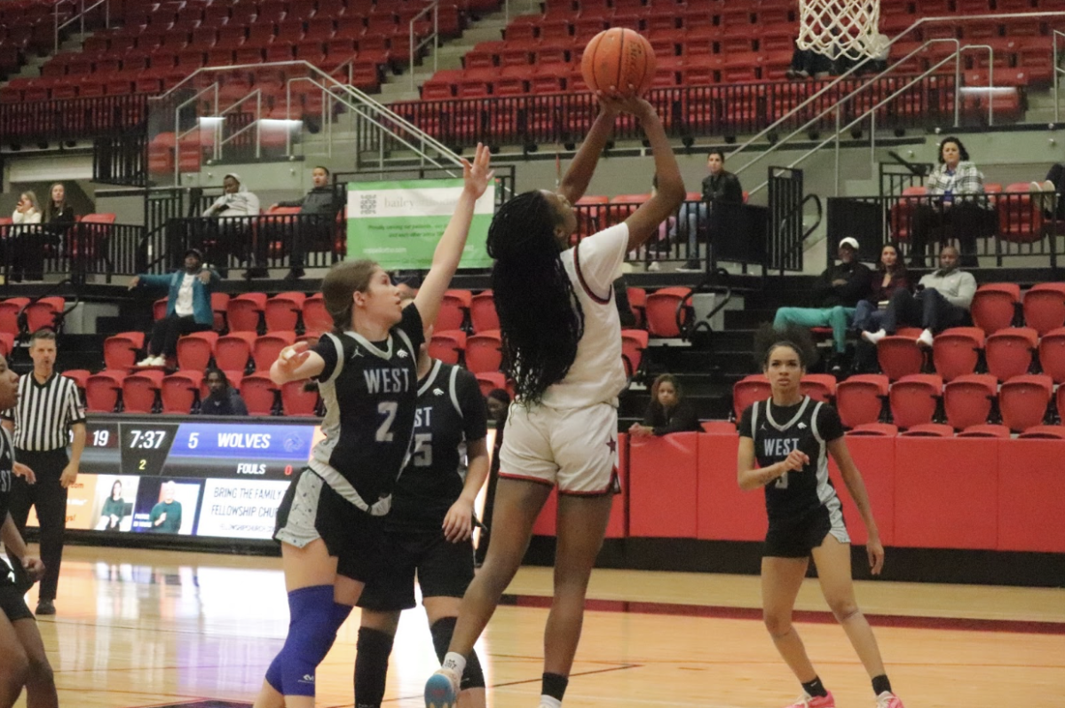 Coppell junior forward Kennedy Paul scores a layup on Tuesday at the CHS Arena. Coppell defeated Plano West, 46-29, in the District 6-6A opener.